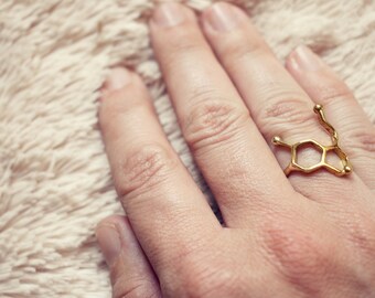 Molecular jewerly, serotonina, happiness hormone in brass metal.
