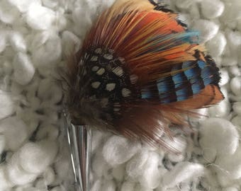 Beautiful and colourful feather brooch