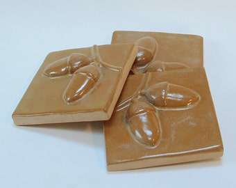 Set of three, 3" Acorn Arts and Crafts tile for fireplace, kitchen and bath with ocher glaze.