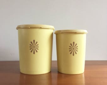 Tupperware set of 2 yellow containers with lids in relief