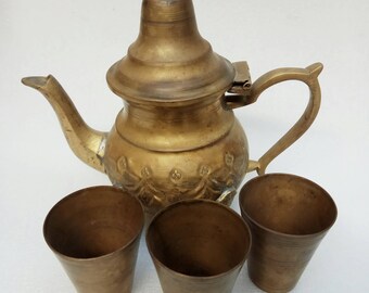 collectible Vintage jug of tea set With 3 small cups