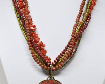 Stunning red tone beaded necklace