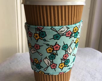 Birds and flowers coffee cozy