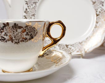 Gold and white teaset: exquisite English “Lucerne” gold and white bone china tea cup, saucer and tea plate, perfect for afternoon tea