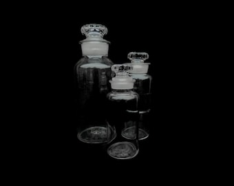 Three antique glass apothecary bottles, 19th century