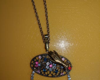 Eyeglass holder pendant.