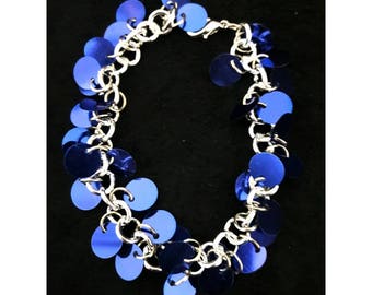 Blue sequin bracelet on silver colored chain