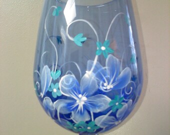 Hand painted wine glass in blue floral