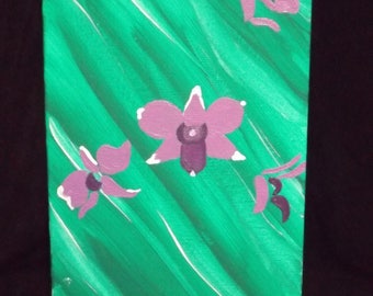 purple orchid on emerald green