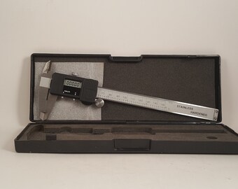 Vintage Electronic Caliper...mm/inch...Has data output port...Scale on rear...Works great in original case with instructions