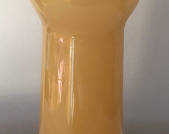 A vintage beige/ orange cased glass vase.