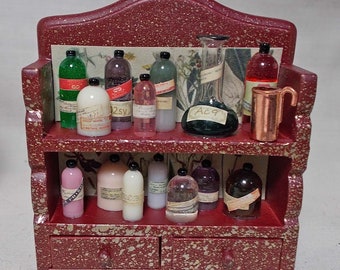 Dolls House Miniature Witch / Wizard Small red/gold potion/poison display.