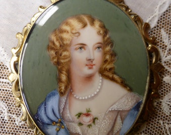 Antique Hand painted Miniature Portrait has been worn on a ribbon as necklace.