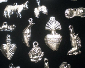 Lot of 25 Mexican religious altar milagros