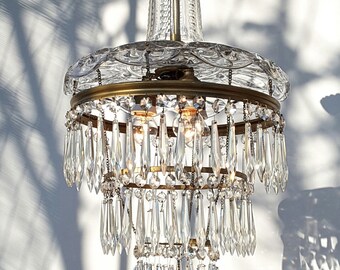 A very rare 1920s beautiful wedding cake chandelier with a crystal cut glass top