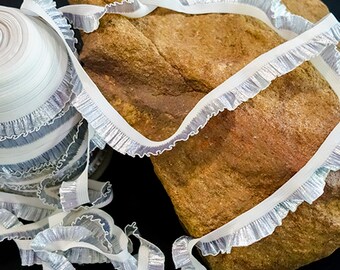White elastic edged silver organza frill