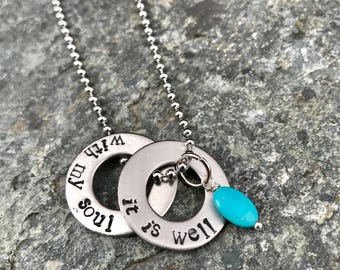 It Is Well With My Soul hand stamped on two stainless steel washers.