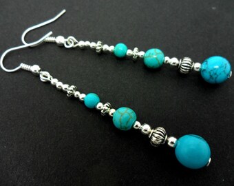 A pair of pretty tibetan silver & turquoise bead long dangly earrings.
