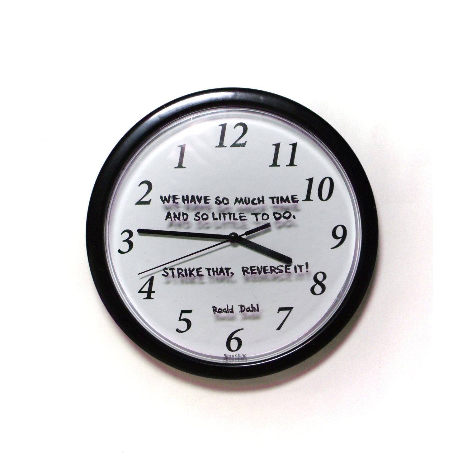 Reverse clock with Raold Dahl quotation hand lettered on the