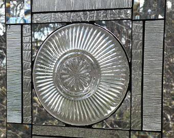 Clear stained glass window panel with plate
