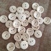 10 wooden buttons with hand made writing