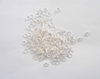 5 grams of jump rings open, bright silver plated, 4 mm. (9251033)