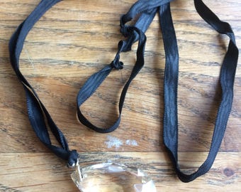 Clear glass pendant on ribbon necklace