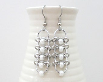 Chainmaille earrings with pearly white beads, Centipede weave