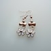 Rose gold and white enamel daisy drop earrings