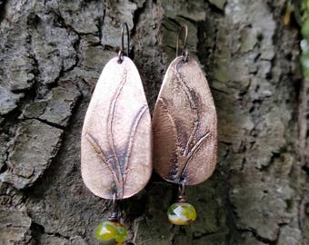 Handmade etched copper earrings.