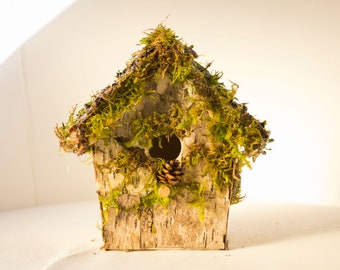 Pretty little fairy house with moss and bark, rustic bird house