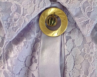Vintage circle pin with hanging stone.....1960s...goldtone