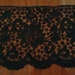 Wide black scalloped lace.