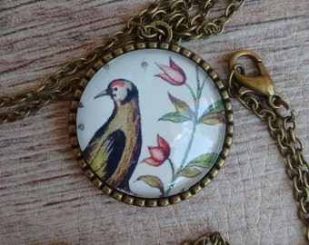 Pendant with bird and flowers