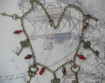 The Gatekeeper necklace, steampunk key necklace, antique bronze, red pressed glass bead charms, whimsical necklace, quirky necklace