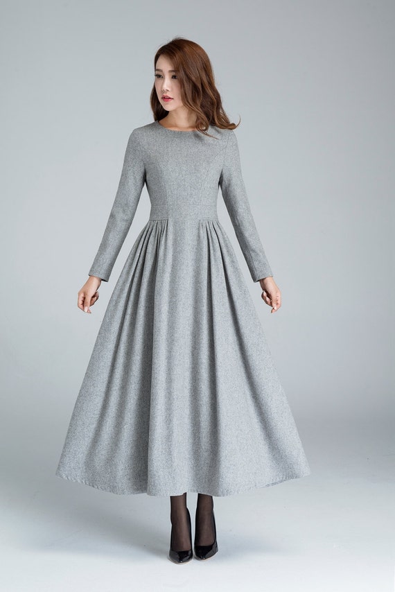 This modern, long-sleeve ballgown from Essense of Australia is the perfect gown for the modern-day bride. Artfully-placed lace accentuates the bodice of this style, creating a high neckline - with cutouts - that extends down into long, lace sleeves.