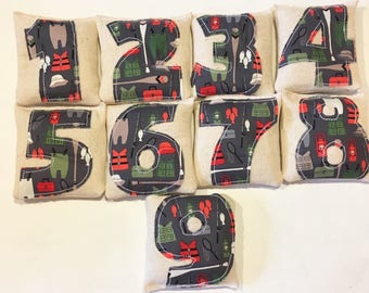 Fabric number beanbags, camping pattern math sensory game