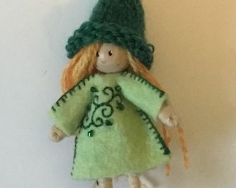 small girl elf bendy doll dressed in green