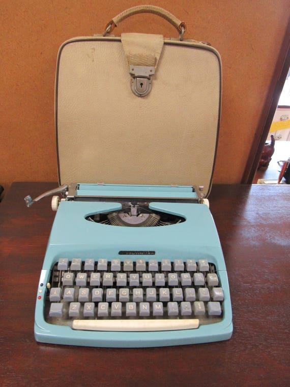 Blue portable typewriter - by Chevron, works great