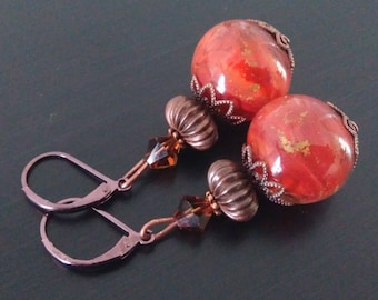 Copper earrings in red and gold.
