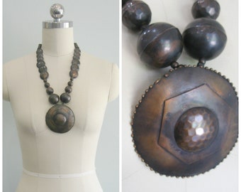 Brassy Hammered Discus Bobble Necklace.