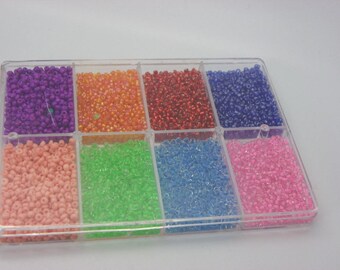 box of assorted seed beads 2-2.5 mm in 8 colors gold, red, blue, green
