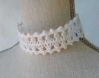 Necklace lace crochet art and fork.