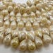 100 Czech Glass Tiny Tear Drop Beads in a Opaque Cream Luster with Picasso Finish Size 4x6mm