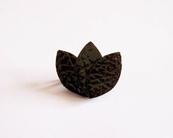 Black patent leather petals brooch