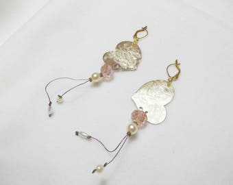 Handmade earrings with bronze hearts and light pink glass beads