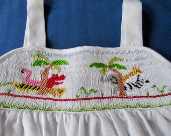 Hand smocked zoo animals.