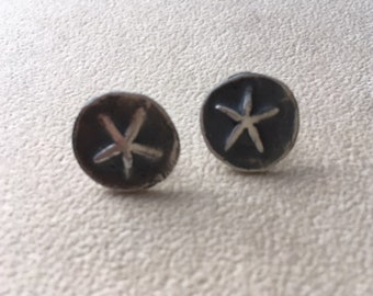 Sterling silver star fish stud earrings.