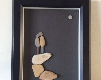 Framed pebble art picture of A couple