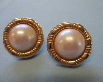 Vintage gold toned round white pearl center pierced Earrings. Not Signed used